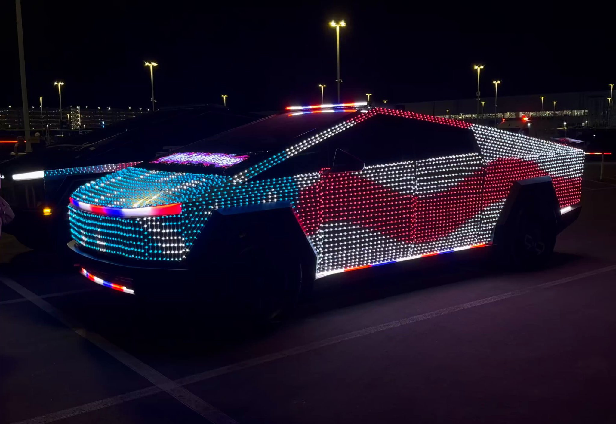 Cybertruck illuminated in red, white and blue at X Takeover, from Sawyer Merritt’s October 10 video